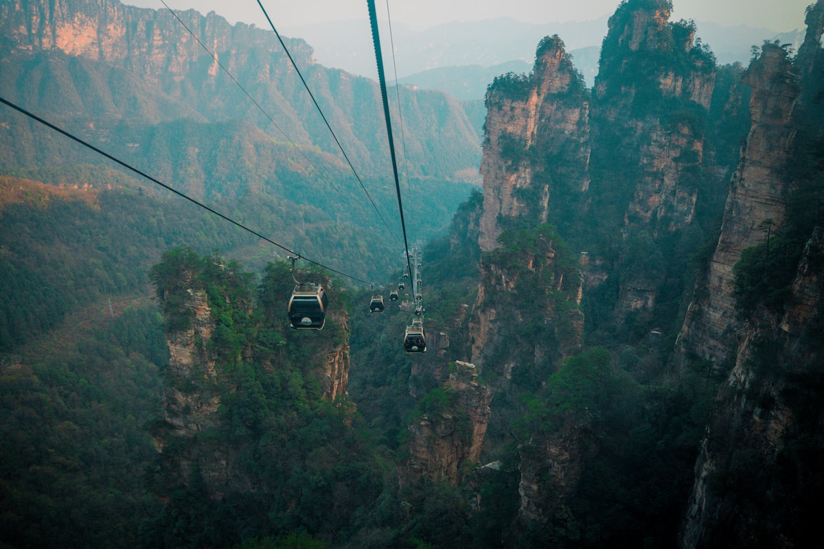 Cable cars traveling through Zhangjiajie mountain scenery